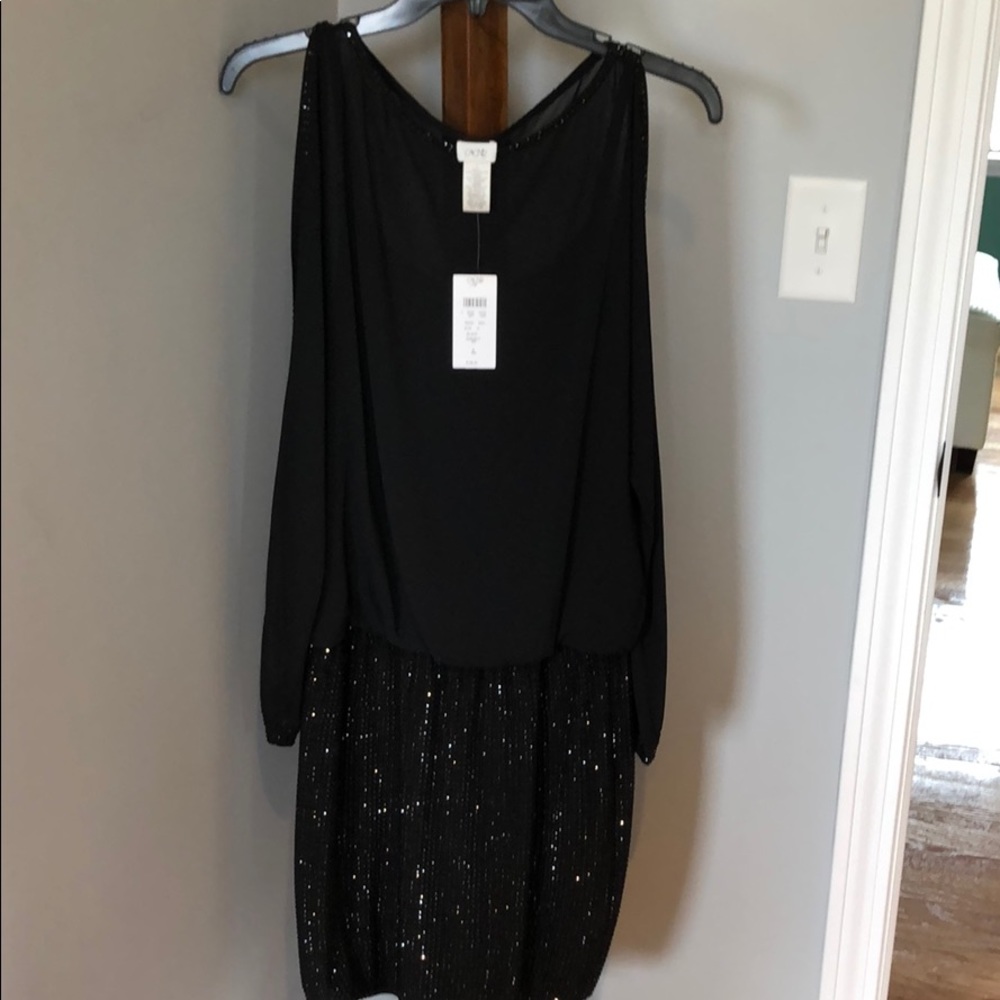 Black dress with sequin bottom. Elastic waist.